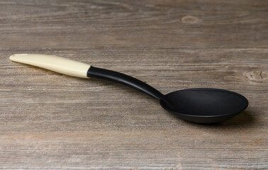 Ladle on Textured Kitchen Table in Warm Light