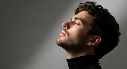 Caucasian male adult in profile with closed eyes. A moment of calm and deep relaxation. Men's grooming and skincare advertising concept. Mindfulness and mental wellbeing