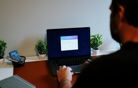 Middle Aged Man Consulting Artificial Intelligence Job Coach Bot - AI Career Quiz Concept