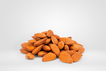 Close-up of a Heap of Raw Almonds on a Plain White Background