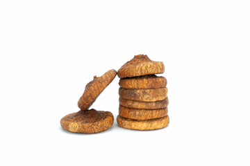 Stack of Dried Fig Slices (Anjeer) and Scattered Pieces on White Background
