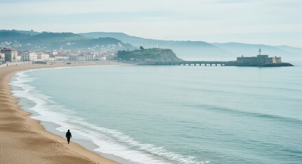 Solitary adult walking on a vast sandy beach. Coastal town landscape with historic lighthouse. Travel destination for mindfulness and personal growth. Contemplative journey by the sea