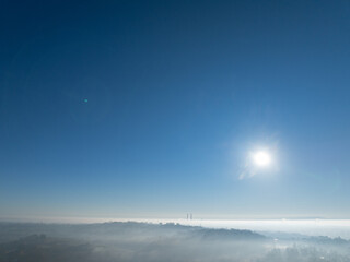 Vast Blue Sky and Bright Sun Over a Sea of Fog