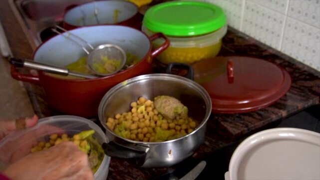 Slow motion, chickpeas stewed in a saucepan.