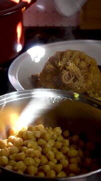 Slow motion, chickpeas stewed in a saucepan.