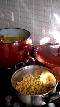 Slow motion, chickpeas stewed in a saucepan.