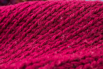 Knitted woolen sweaters. A bunch of knitted winter, autumn clothes, sweaters, knitwear, space for the text.