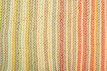 Sweater or scarf fabric texture large knitting. Knitted jersey background with a relief pattern. Wool hand- machine, handmade.