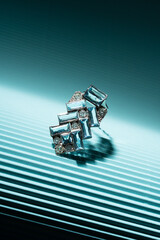 white gold and platinum brooch with diamonds and eight aquamarines, photographed on blue paper