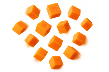 Diced carrots falling on transparent background, fresh orange vegetable ingredient preparing for healthy cooking meal