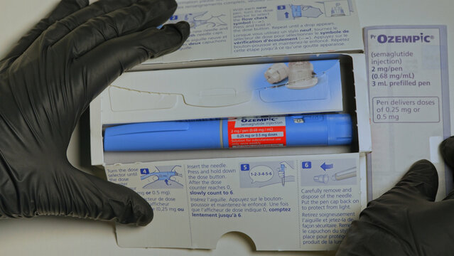 Ozempic Injection box package and pen closeup display with instructions. Ozempic drug medication for Diabetes treatment. Unprescribed abuse for weight loss: Toronto, Ontario, Canada - October 28, 2025