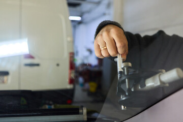 Detailed evaluation of resin patch and reflective surface integrity, Thorough inspection through natural lighting to ensure repair quality and visual perfection