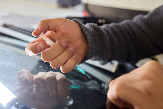 Detailed evaluation of resin patch and reflective surface integrity, Thorough inspection through natural lighting to ensure repair quality and visual perfection