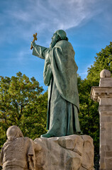 Budapest, Hungary - July 27, 2025: Statue of Saint Gell&eacute;rt by Alajos Str&oacute;bl, installed in 1904, located on Gell&eacute;rt Hill overlooking the city
