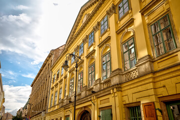 Fototapeta premium Budapest, Hungary - July 27, 2025: Traditional residential architecture with colorful facades and ornate details in central Budapest 