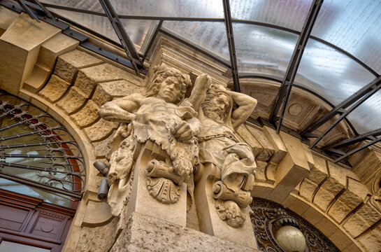 Budapest, Hungary - July 27, 2025: Ornate Neo-Baroque and Neo-Renaissance architectural details on the facade of a historic building in central Budapest. The decorative stone carvings, columns, and sy - Powered by Adobe