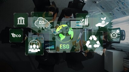 A group of professionals collaborate in a modern office setting, focusing on ESG strategies while interactive digital icons depict environmental, social, and governance themes. Raster