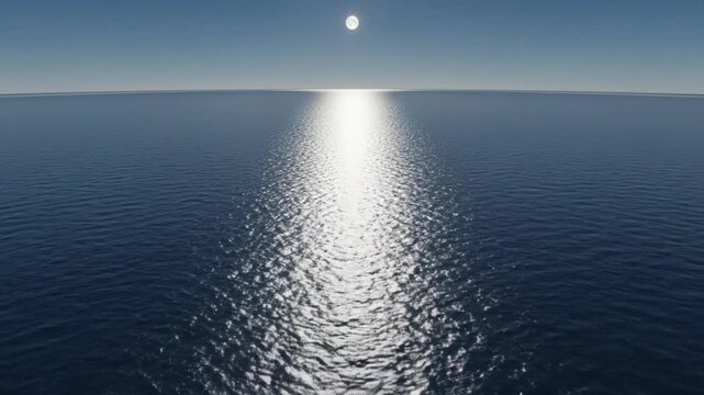 Flying over a calm open ocean with a bright sun reflection on the water surface. A serene and tranquil seascape with a clear blue sky