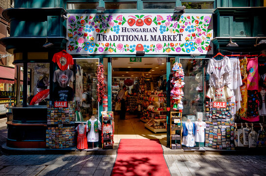 Budapest, Hungary - July 27, 2025: Entrance to a Hungarian traditional market shop selling folk clothing, souvenirs, and handmade crafts in the city center
