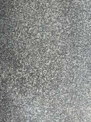 Gray Granite Texture Background. High-resolution photo of natural grey granite texture. Seamless stone surface for backgrounds, materials, and architectural use.