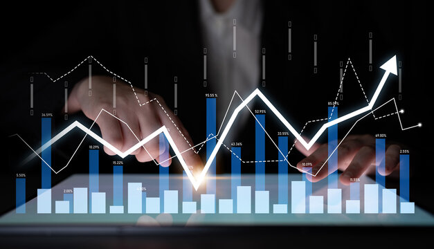 Professional business analytics image featuring a digital tablet displaying data trends and financial graphs, ideal for market analysis and financial presentations. Scalp - Powered by Adobe
