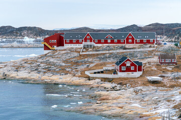Hospital in the city of Ilulissat, Greenland. Traditional greenlandic wooden architecture. Colorful...