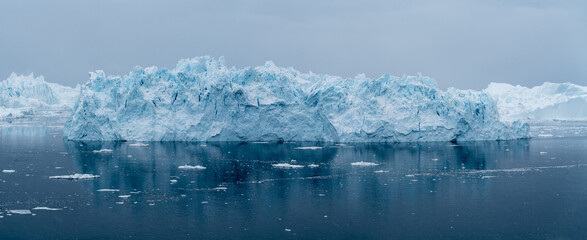 Giant icebergs floating in Ilulisat icefjord, Greenland. Massive icebergs, calved from the Sermeq Kujalleq Glacier, float through the Ilulissat Icefjord in western Greenland © Petr