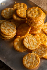 Round Crackers Snack.
A close-up photo of round crackers. Perfect for food, snack, bakery, or cooking-related projects.