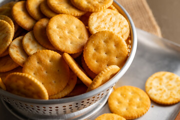 Round Crackers Snack.
A close-up photo of round crackers. Perfect for food, snack, bakery, or cooking-related projects.