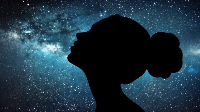 Celestial Contemplation: A woman's silhouette is set against a starry cosmic backdrop. This image embodies introspection, hope, and the boundless mystery of the universe.