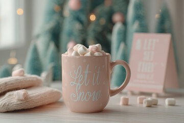 A cozy pink mug filled with marshmallows sits on a wooden table. Soft blankets and pastel Christmas trees create a warm holiday atmosphere.