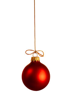 A red Christmas ball ornament hanging from a gold string with a transparent background.