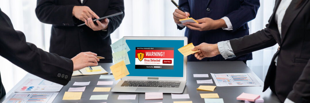 Analyst team use sticky note for creative and analytic brainstorm for business idea with BI data dashboard on laptop screen. Analysis financial data visualization tech for marketing strategy. Prodigy - Powered by Adobe