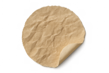 Round beige crumpled paper sticker with a peeled corner, creating a distressed empty label for text or price on transparency