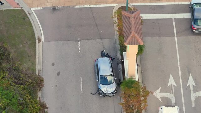 First responders at car accident site in Florida. Emergency services personnel helping victims of car crash on city street in USA.