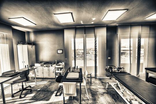 Well-equipped physiotherapy center with medical beds and advanced rehabilitation devices - Powered by Adobe