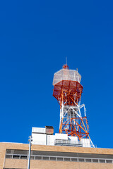 Looking up at the buildings of Yokohama under the blue sky.