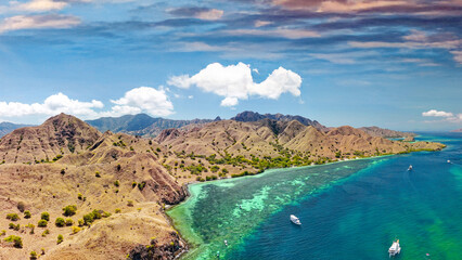 Aerial panoramic view of Pink Beach in Komodo National Park surrounded by turquoise tropical waters