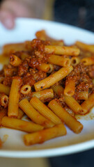 Enjoying a lunch outdoors at an Italian restaurant with traditional dishes on the table