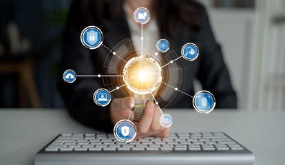 A businesswoman presents a glowing sphere surrounded by digital security icons, symbolizing...