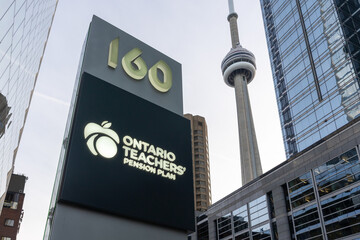 Naklejka premium Toronto, ON, Canada - November 8, 2025: The sign of Ontario Teachers' Pension Plan (OTPP) with the CN Tower background is seen in Toronto, ON, Canada. OTPP is an independent corporation.