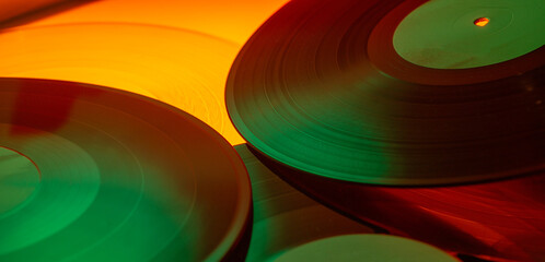 Multicolored vinyl discs for a music banner background