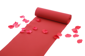 Partially unrolled red fabric with scattered rose petals on transparent background