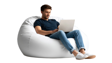 Relaxed Focus: A man engrossed in his laptop sits comfortably in a beanbag chair, showcasing the perfect blend of relaxation and productivity, captured in a moment of tranquil work.