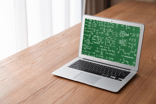 Mathematic equations and modish formula on computer screen showing concept of science and education
