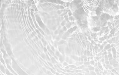 White water with ripples on the surface. Defocus blurred transparent white colored clear calm water surface texture with splashes and bubbles. Water waves with shining pattern texture background.