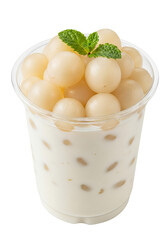 A clear plastic cup filled with a creamy, pale white dessert or drink, topped generously with plump, translucent white rambutan arils