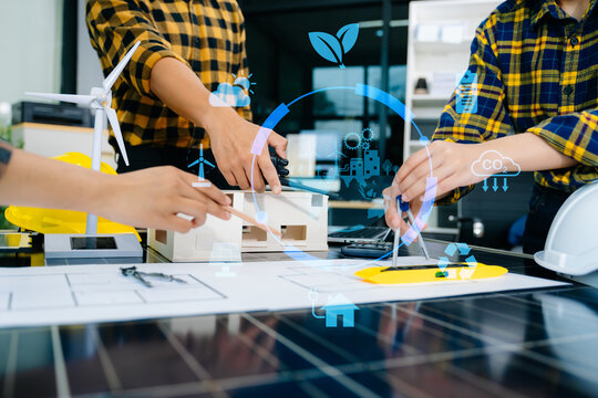 Business team working virtual modern smartphone to reduce CO2 emissions carbon footprint climate change with icons - Powered by Adobe