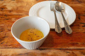 soup and plate with spoon and fork on the wooden table in arabic restaurant in jeju island
