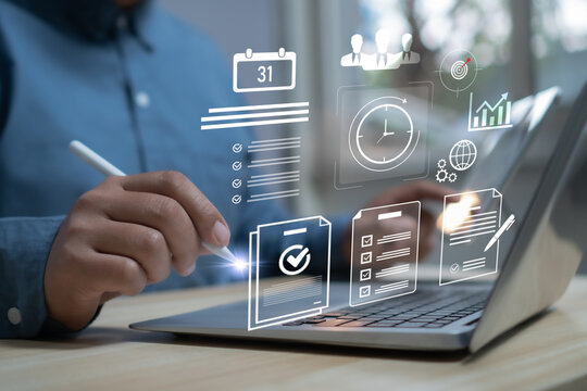 Businessman using laptop with digital task management system showing checklist, schedule, clock, and data icons productivity, workflow planning, time management, and business efficiency concept.